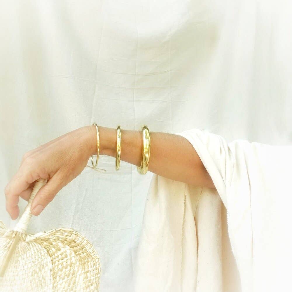  Bangle Bracelet Set offers minimalist elegance. Handmade from high-quality brass, perfect for stacking or solo wear.