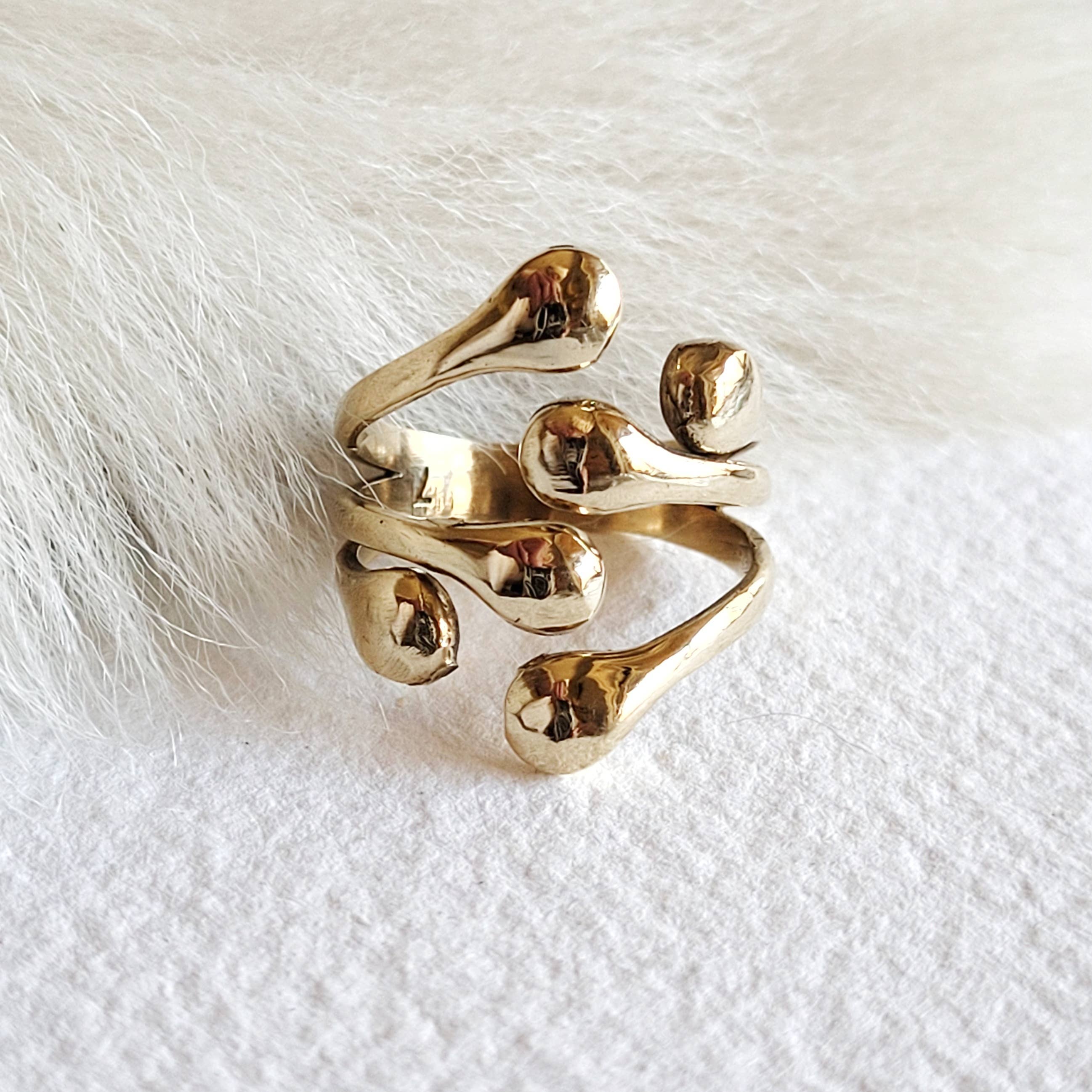 Cluster Ring is a bold, modern statement piece. Hand-cast in solid brass with organic freeform orbs, creating a sculptural, unique design