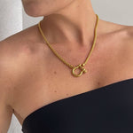Gold Shackle Chain Necklace features a sleek box chain & bold clasp. 18K gold-plated, waterproof & hypoallergenic.