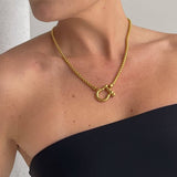 Gold Shackle Chain Necklace features a sleek box chain & bold clasp. 18K gold-plated, waterproof & hypoallergenic.