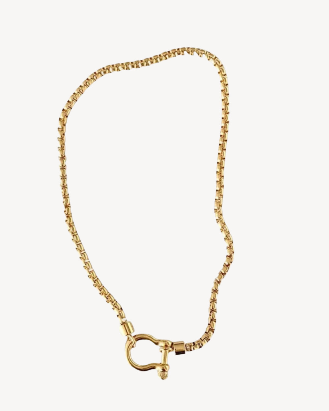 Gold Shackle Chain Necklace features a sleek box chain & bold clasp. 18K gold-plated, waterproof & hypoallergenic.