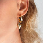 Heart Gold Earrings. 18K gold-plated, hypoallergenic & tarnish-resistant on model