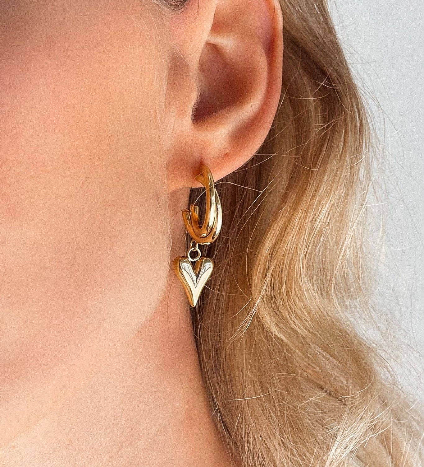 Heart Gold Earrings. 18K gold-plated, hypoallergenic & tarnish-resistant on model