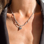 Heart Gold Necklace. Silver, hypoallergenic & tarnish-resistant, featuring a delicate heart charm on model