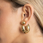 Kelly Tube Hoop Earrings Gold on Model 1