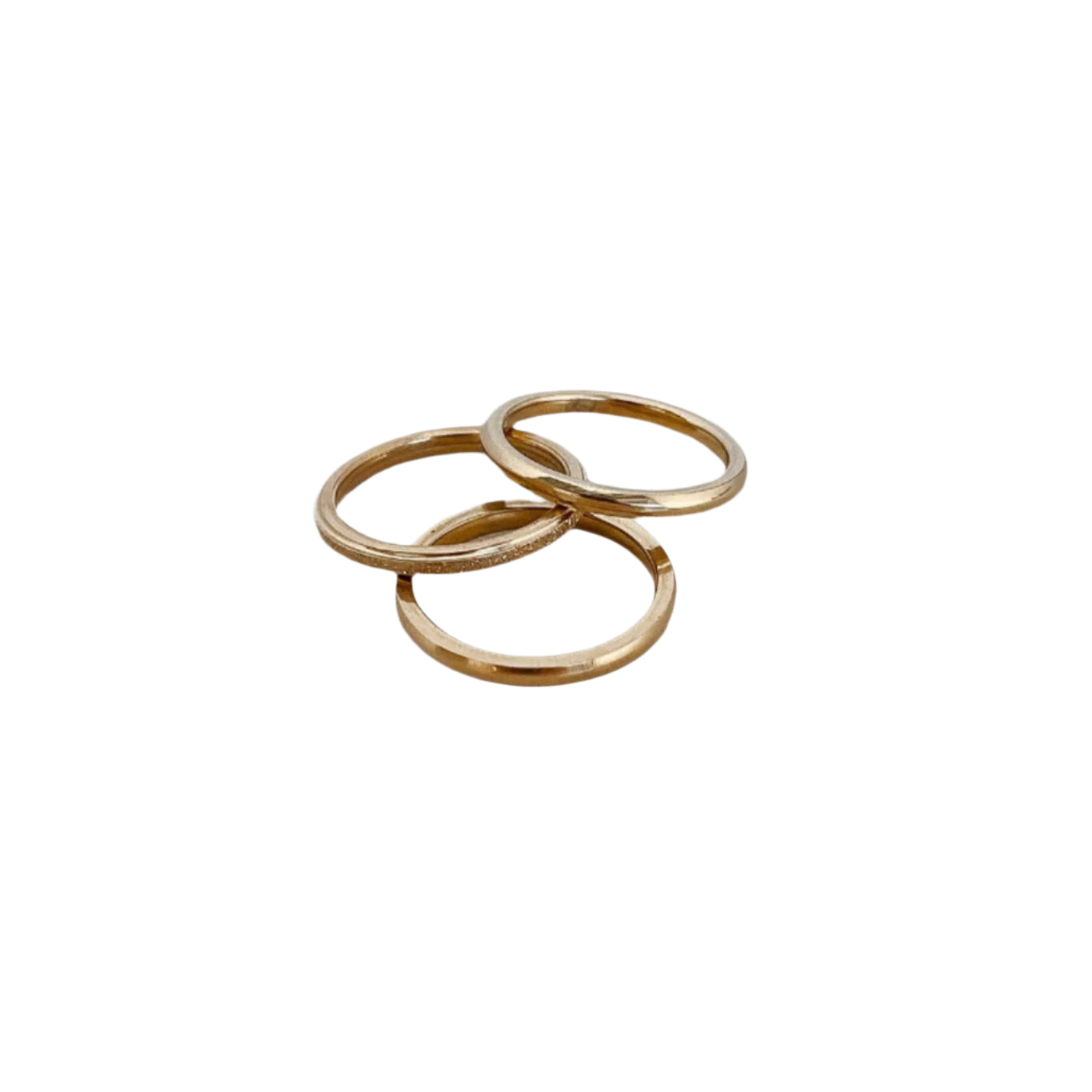 Three Sisters Stacking Ring Set features a trio of sleek & textured 18K gold-plated rings. Waterproof, hypoallergenic