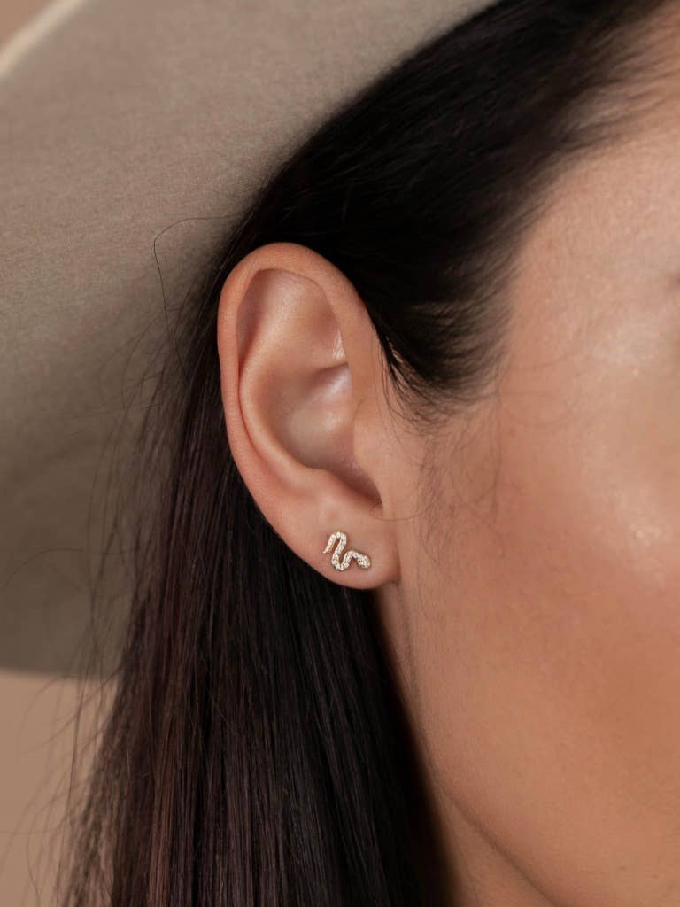 Year of the Snake, these gold-plated stud earrings feature CZ stones