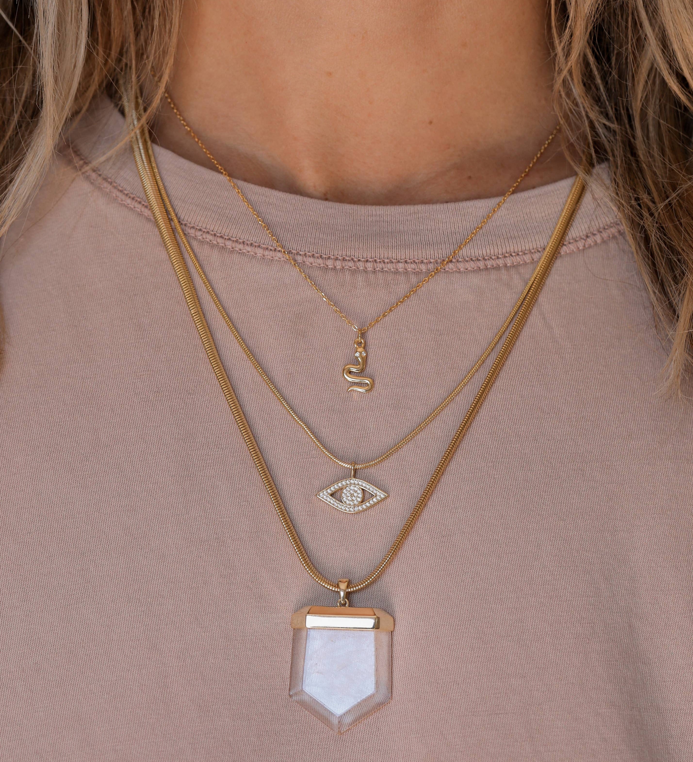 Year of the Snake, this gold-plated necklace features CZ stones layered