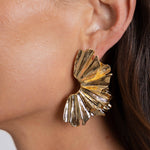 arabela modern statement earrings on a model ear