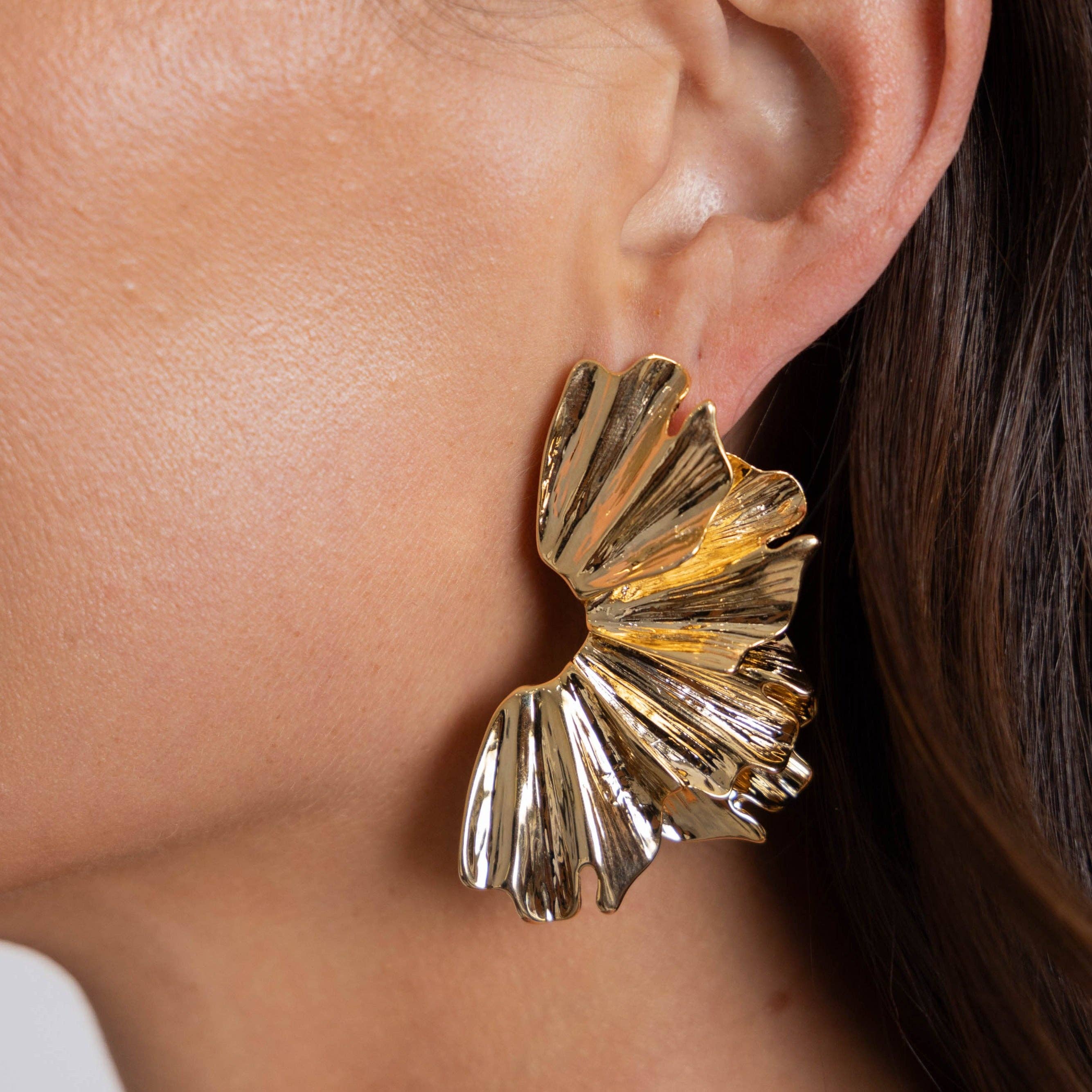 arabela modern statement earrings on a model ear